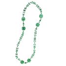 Close-up of green plastic shamrock medallions and letter beads on St Patrick's Day necklace