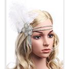Silver 1920s flapper headband with white ostrich feather and crystal medallion