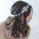 Art Deco bridal headpiece showing flexible metal link construction and adjustable satin ribbon ties