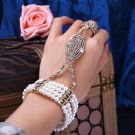 Flapper style pearl hand chain bracelet with adjustable elastic bands and Art Deco geometric design