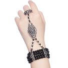 Flapper-style hand jewelry showing elastic bracelet connected to adjustable ring