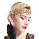 Gold 1920s flapper headpiece with rhinestone flowers and chain swags on elastic band