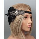 Black 1920s flapper headband with Art Deco beadwork and feather plume on mannequin