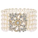 Adult 1920s pearl bracelet with five strands and rhinestone centerpiece brooch
