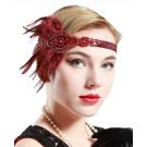 Side view of wine red feather headband showing elastic band and sequined fabric