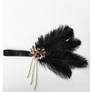 Art Deco headpiece with ostrich feather, pink jeweled brooch, and gold beaded chains