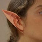Beige latex elf ears spotlight with clip-on attachment mechanism