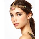 Gold chain 1920s headpiece with pink and emerald crystals on white background