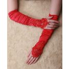 Red satin fingerless opera gloves with ruched texture and rhinestone lace detail