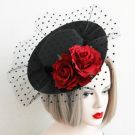 Victorian-style burlesque hat with sculptural brim and floral detail