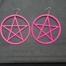 Hot pink pentagram star dangle earrings with silver fishhook ear wires on white background