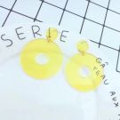 Neon yellow 80s dangle earrings with circular disc studs and oversized hoop pendants