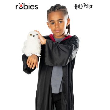 Harry Potter Hedwig plush owl perched on child's wrist with red gauntlet strap