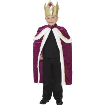 Child wearing purple royal king costume with gold crown and white fur trim