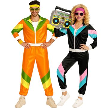 Adult couple wearing matching 80s shell suit costumes with neon color blocking