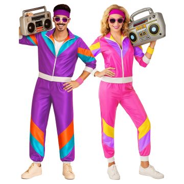 Adult wearing purple and turquoise 80s shell suit tracksuit with geometric color blocking