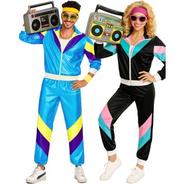 Adult couple wearing matching 80s shell suit costumes in blue and black colourways