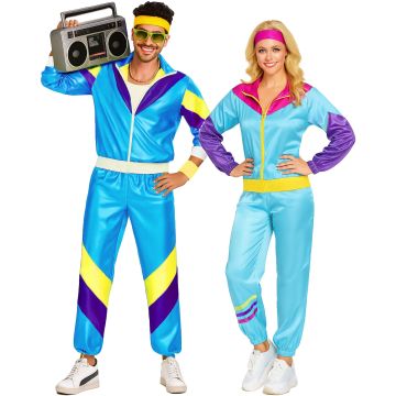 Adult couple wearing matching 80s shell suit costumes in electric blue and hot pink with bold colour blocking