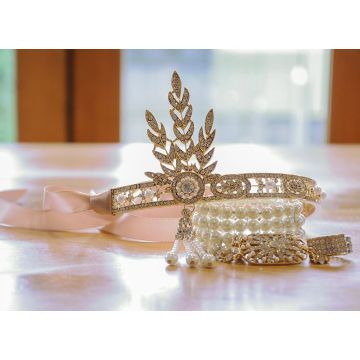 Art Deco gold headband with feather-leaf crystal centerpiece and triple-pearl tassel drop