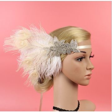 Ivory 1920s flapper headband with peacock feather and rhinestone appliqué