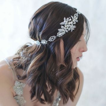 Art Deco bridal headpiece showing flexible metal link construction and adjustable satin ribbon ties