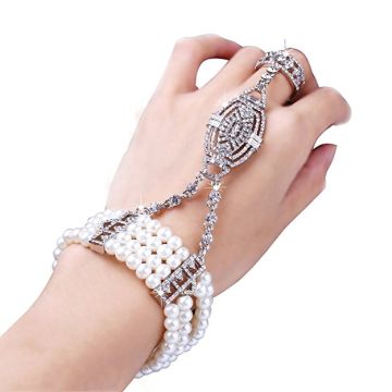 1920s Gatsby hand jewelry showing bracelet-to-ring chain connection