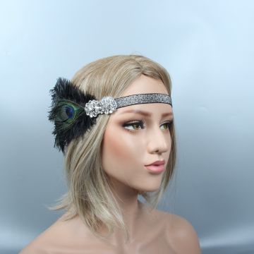 Silver glitter flapper headband with black feathers and peacock eye on blonde model