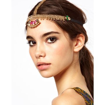 Gold chain 1920s headpiece with pink and emerald crystals on white background