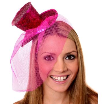 Hot pink glitter mini top hat on headband with mesh veil