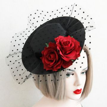 Victorian-style burlesque hat with sculptural brim and floral detail
