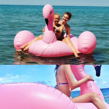 190cm flamingo float showing glossy PVC finish, white chest detail, and wide seating area