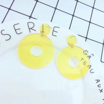 Neon yellow 80s dangle earrings with circular disc studs and oversized hoop pendants