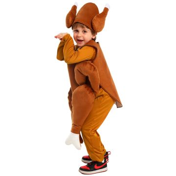 Child wearing plush turkey tabard vest with padded drumstick attachments