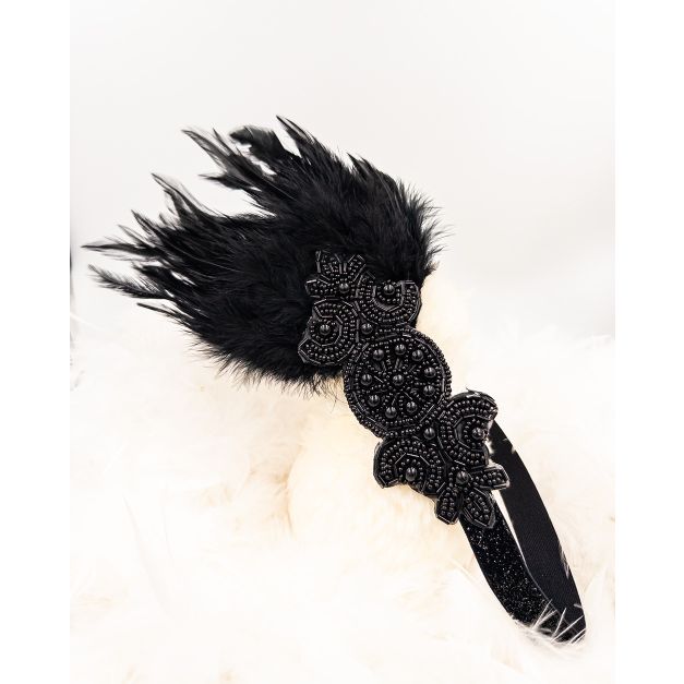 Close-up of ornate circular beaded medallion on Gatsby era headpiece with elastic band