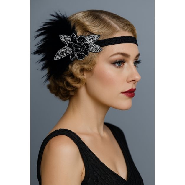 Black 1920s feather headband with silver beaded Art Deco flower, side view showing feather cluster Black 1920s feather headband with silver beaded Art Deco flower, side view showing feather cluster