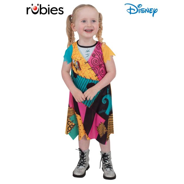 Toddler girl wearing Sally costume dress with patchwork print and raw edges Toddler girl wearing Sally costume dress with patchwork print and raw edges