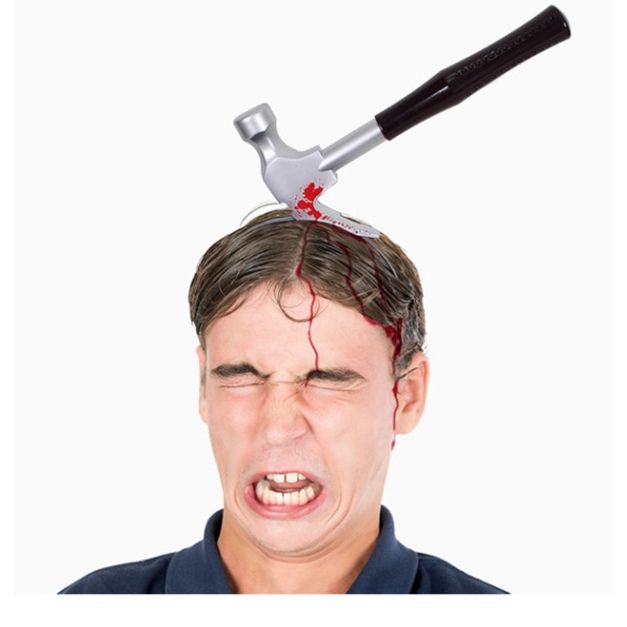 Close-up of blood-splattered hammer headband showing red gore detailing and textured black handle grip Close-up of blood-splattered hammer headband showing red gore detailing and textured black handle grip