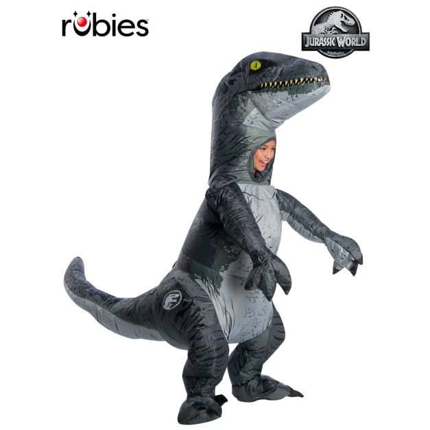 Child wearing stone-grey Velociraptor Blue inflatable costume with metallic blue stripe and articulated tail Child wearing stone-grey Velociraptor Blue inflatable costume with metallic blue stripe and articulated tail