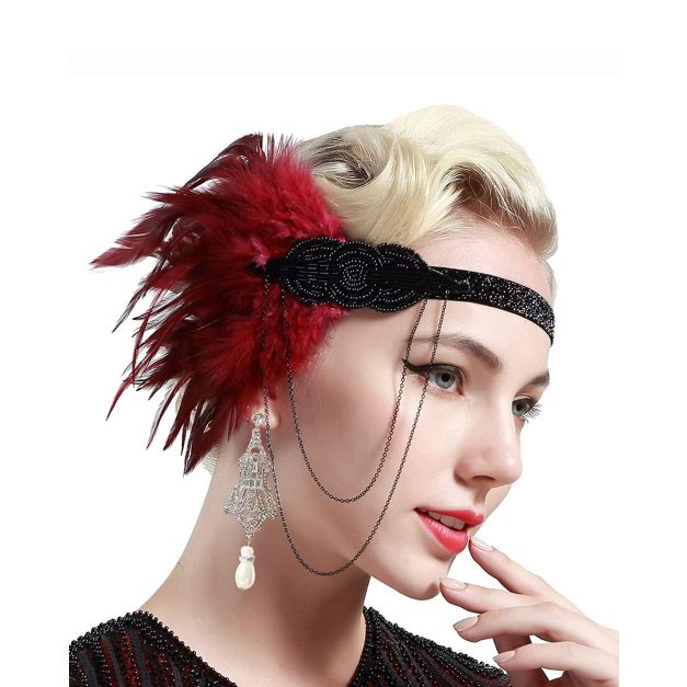 Adult woman wearing burgundy feather flapper headband across forehead in vintage style