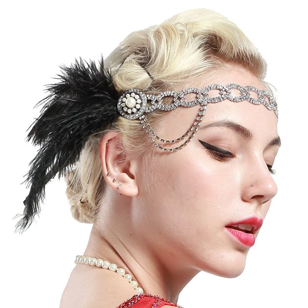 Silver rhinestone chain headband with black ostrich feather and pearl medallion Silver rhinestone chain headband with black ostrich feather and pearl medallion