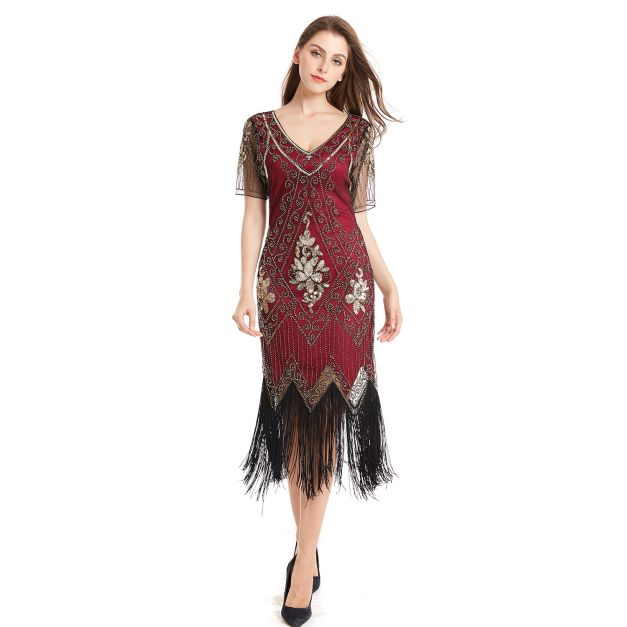 Women's burgundy 1920s flapper dress with beaded Art Deco scrollwork and black fringe hem Women's burgundy 1920s flapper dress with beaded Art Deco scrollwork and black fringe hem