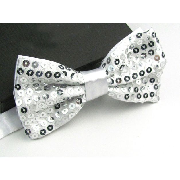 Close-up of alternating white and silver faceted sequins on bow tie surface Close-up of alternating white and silver faceted sequins on bow tie surface