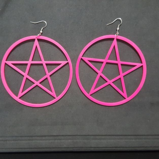 Hot pink pentagram star dangle earrings with silver fishhook ear wires on white background