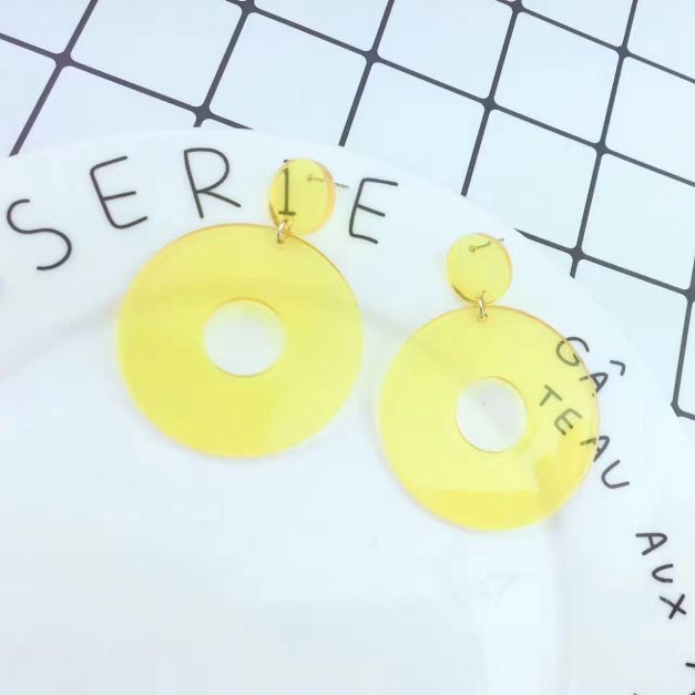 Neon yellow 80s dangle earrings with circular disc studs and oversized hoop pendants Neon yellow 80s dangle earrings with circular disc studs and oversized hoop pendants