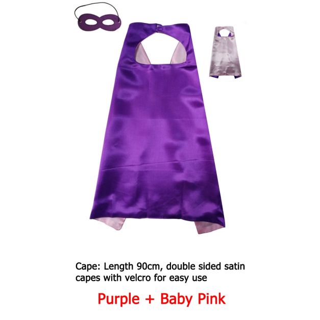 Child wearing double-sided satin cape showing velcro neck closure and eye mask Child wearing double-sided satin cape showing velcro neck closure and eye mask