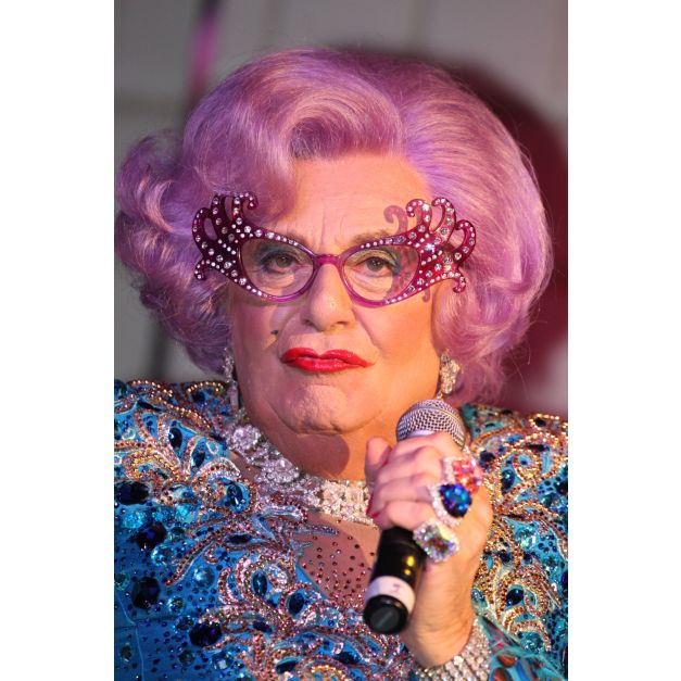 Purple bouffant wig with pink highlights and voluminous curls for Dame Edna outfit Purple bouffant wig with pink highlights and voluminous curls for Dame Edna outfit