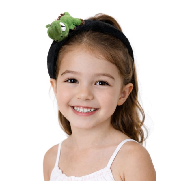 Kids dinosaur headband with bright green plush T-Rex character and googly eyes on black padded band Kids dinosaur headband with bright green plush T-Rex character and googly eyes on black padded band
