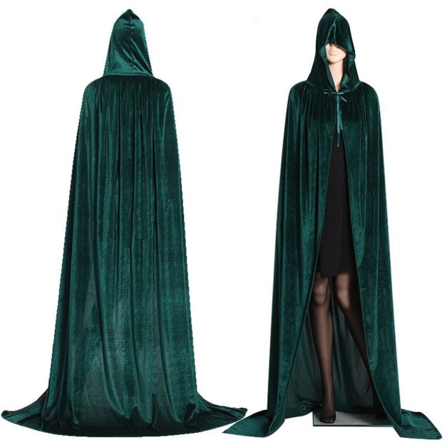 Close-up of green velvet texture and black interior lining on kids wizard cape Close-up of green velvet texture and black interior lining on kids wizard cape